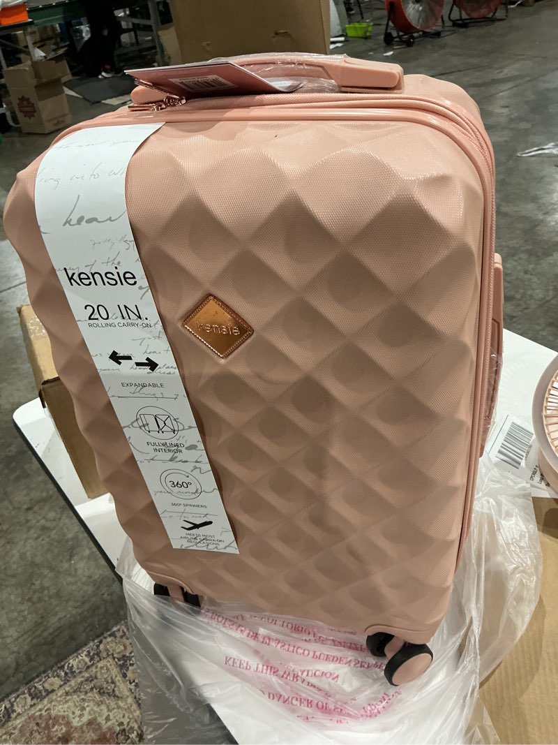 Condition photo showing Good Condition for 20 in. dusty pink rolling expandable carry-on luggage