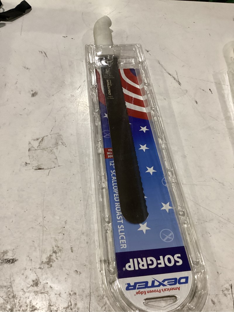 Condition photo showing New/Like New for dexter-russell sofgrip 12" scalloped roast slicer knife | 24243 | high-carbon dexsteel blade | non-slip soft rubber grip handle | nsf certified, stain-free, made in usa