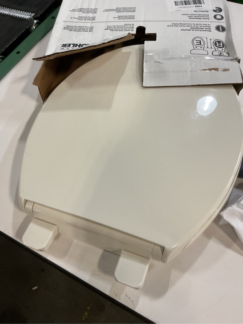 Condition photo showing As Is for KOHLER 20111-96 Brevia, Slow Close Toilet Seat, Round Toilet Seat, Grip-Tight Bumpers Quick-Attach Hardware, Biscuit Biscuit Round Quiet-Close