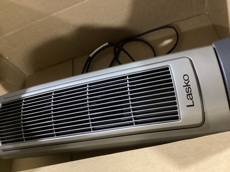 Condition photo showing As Is for Lasko Portable Oscillating Ceramic Space Heater Tower with Digital Display, Remote Control, 2 Heat Settings and 8 Hour Timer, Gray