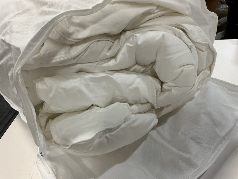 Condition photo showing As Is for premium down alternative comforter, full/queen, white
