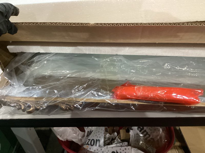 Condition photo showing Good Condition for Kate and Laurel Myrcelle Traditional Arched Mirror with Shelf, 21 x 28, Antique Gold, Vintage Arch Shelf Mirror with Ornate Garland Detailing Along The Crown and Edges of The Frame