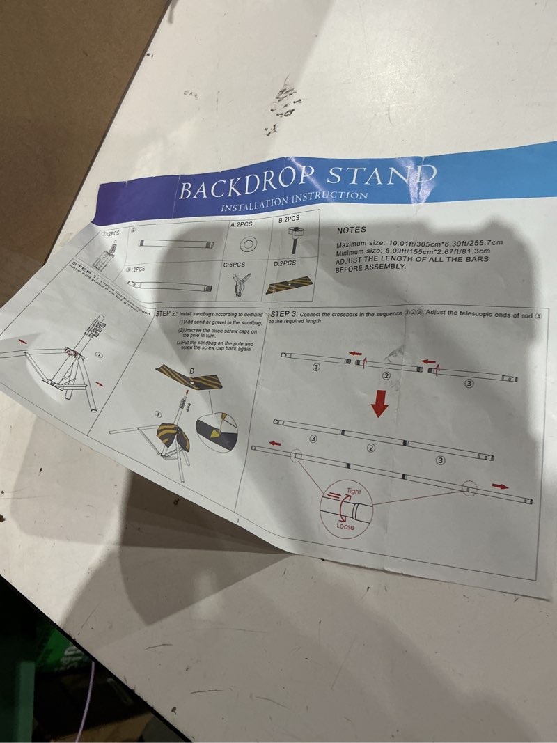 Condition photo showing As Is for backdrop stand  installation instruction