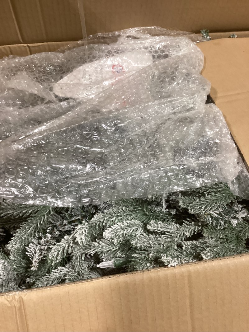 Condition photo showing As Is for Puleo International 6ft Pre-Lit Potted Flocked Arctic Fir Pencil Christmas Tree with 120 Warm White Lights, 1325 Realistic Dense Snow Flocked Branch Tips, Easy Setup Artificial Trees with Sturdy Stand 6' Flocked Arctic Fir 120 Clear Lights