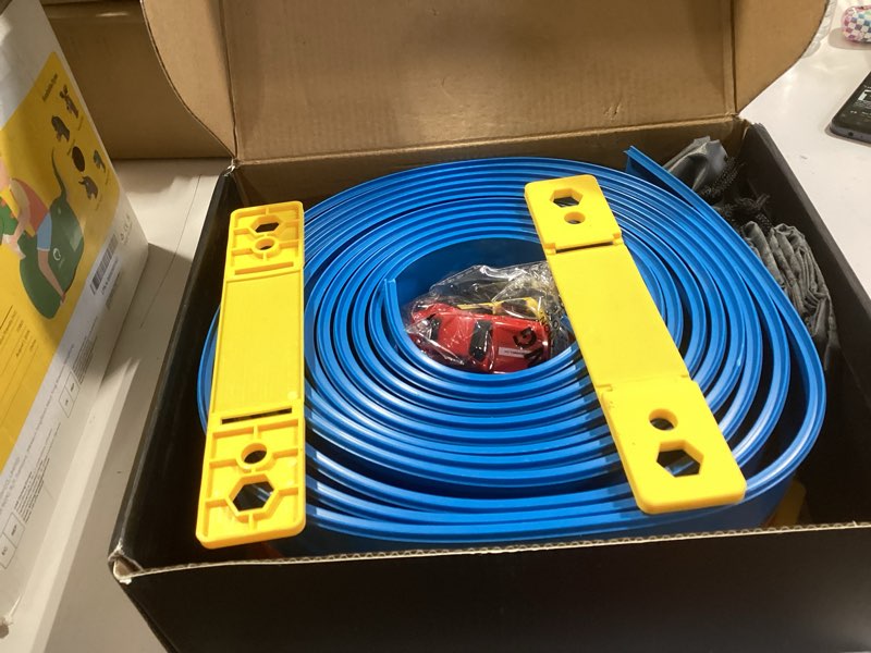 Condition photo showing Good Condition for 20ft flexible race track for kids with 4 pull-back cars & portable storage bag,4pcs strong suction cups,5pcs track stabilizers,for 1/64 cars,roll up slot car race track with loops