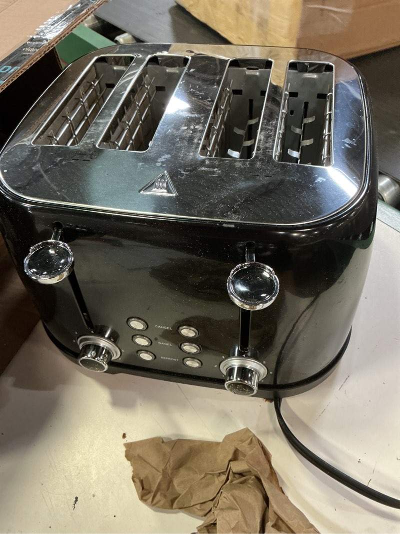 Condition photo showing As Is for amazon basics 4 slice toaster with 4 slots, 6 browning settings, defrost, removable crumb tray, bagel function, cancel button, 1600w, black black 4 slice toaster