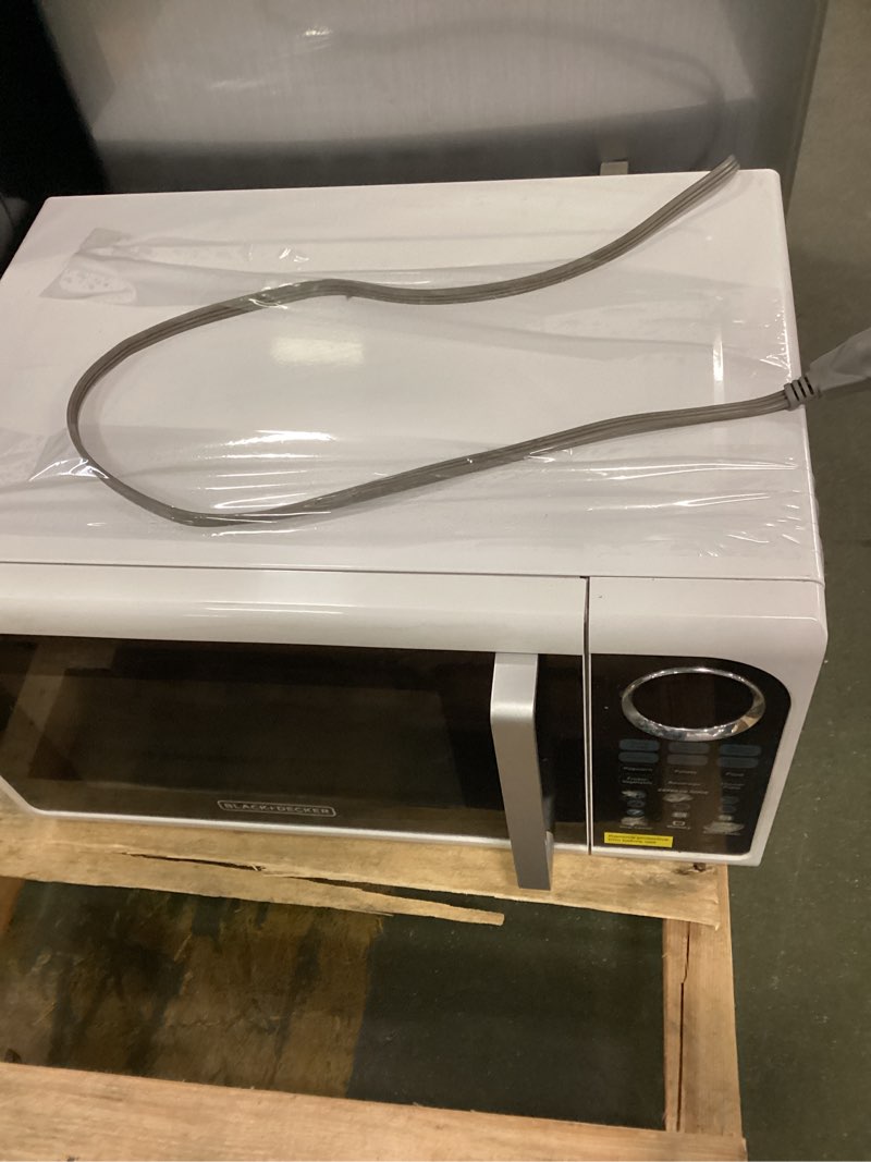 Condition photo showing As Is for BLACK+DECKER 0.9 cu ft Countertop Microwave Ovens in White