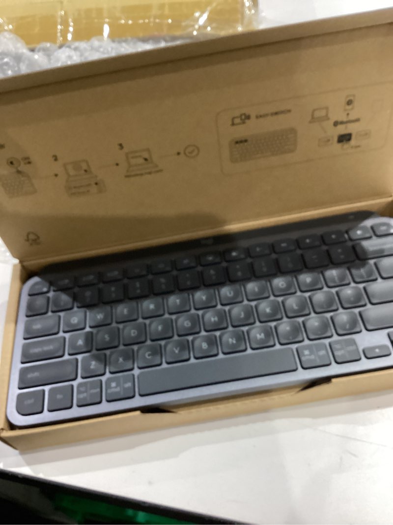 Condition photo showing New/Like New for logitech mx keys mini minimalist wireless illuminated keyboard, compact, bluetooth, backlit, usb-c, compatible with apple macos, ios, windows, linux, android, metal build - graphite mx keys mini graphite