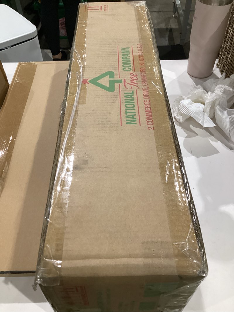 Condition photo showing New/Like New for national tree company 9 ft pre-lit crestwood spruce artificial christmas garland, christmas decoration with glitter, pinecones, red berries, 50 clear lights, 180 tips, green plug in tree