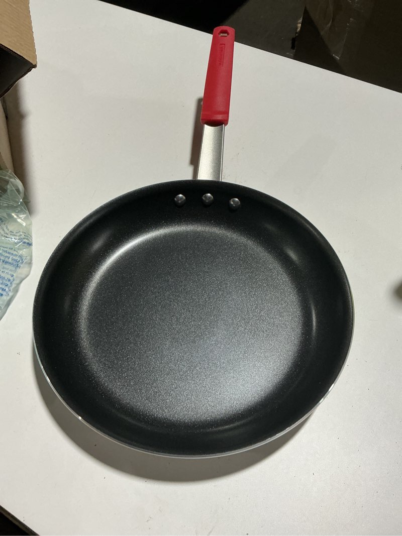 Condition photo showing Good Condition for Tramontina Professional 12-Inch Non Stick Large Frying Pan, Heavy-Gauge Aluminum Skillet with Reinforced Nonstick Coating, Red Handle, Dishwasher and Oven Safe Nonstick (Red handle) 12 Inch