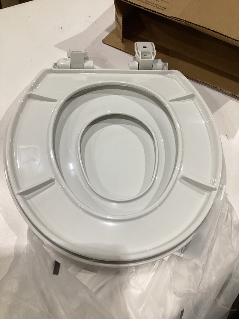 Condition photo showing As Is for mayfair little2big? round plastic toilet seat in white with sta-tite? seat fastening system? and whisper•close? hinge