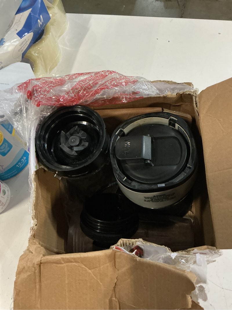 Condition photo showing As Is for ninja fit compact personal blender | for smoothies, shakes & frozen drinks | (2) 16-oz. to-go cups with spout lids | 700-watt countertop | black | qb3001ss push to blend