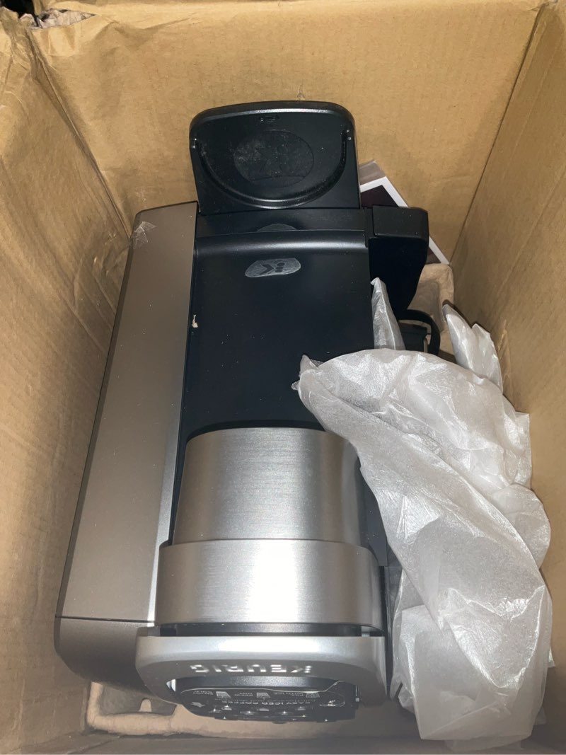 Condition photo showing As Is for keurig k-elite single serve k-cup pod coffee maker, with strength and temperature control, iced coffee capability, 8 to 12oz brew size, programmable, brushed silver