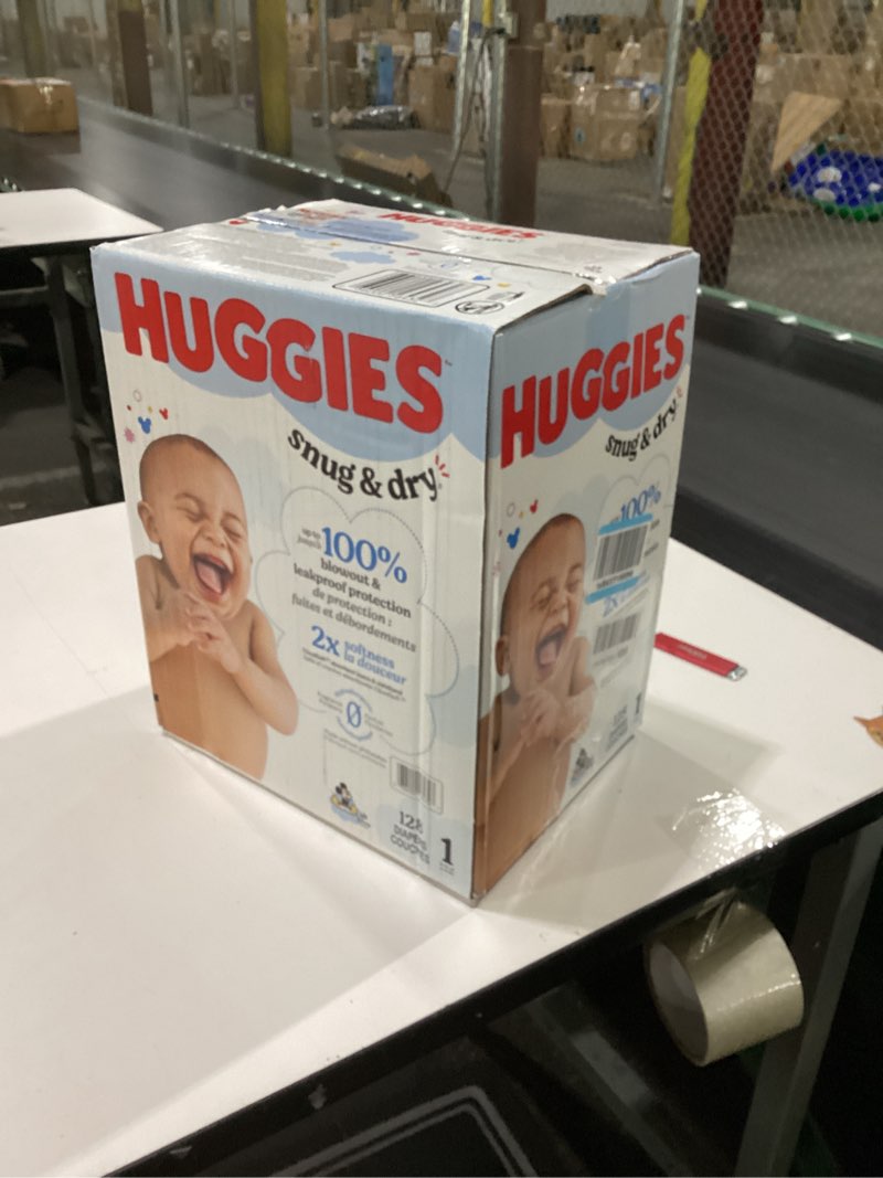 Condition photo showing New/Like New for Huggies Size 1 Diapers, Snug & Dry Newborn Diapers, Size 1 (8-14 lbs), 128 Count, Packaging May Vary Size 1 128