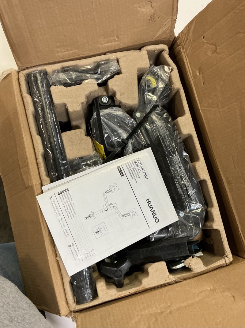 Condition photo showing As Is for huanuo dual monitor stand, fully adjustable gaming monitor desk mount for 13–32? computer screens, full motion vesa with c-clamp & grommet base, each arm holds 4.4 to 19.8 lbs black