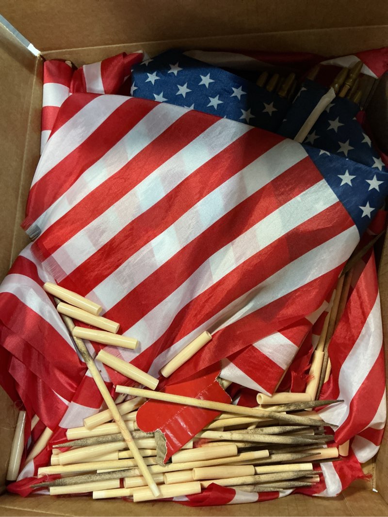 Condition photo showing As Is for mindsoft 18 x 12 inch american flags on stick 250th handheld usa flags with spear top 4th of july decorations ground wood flagpole pluggable stick for memorial day independence day parades(50 pack)