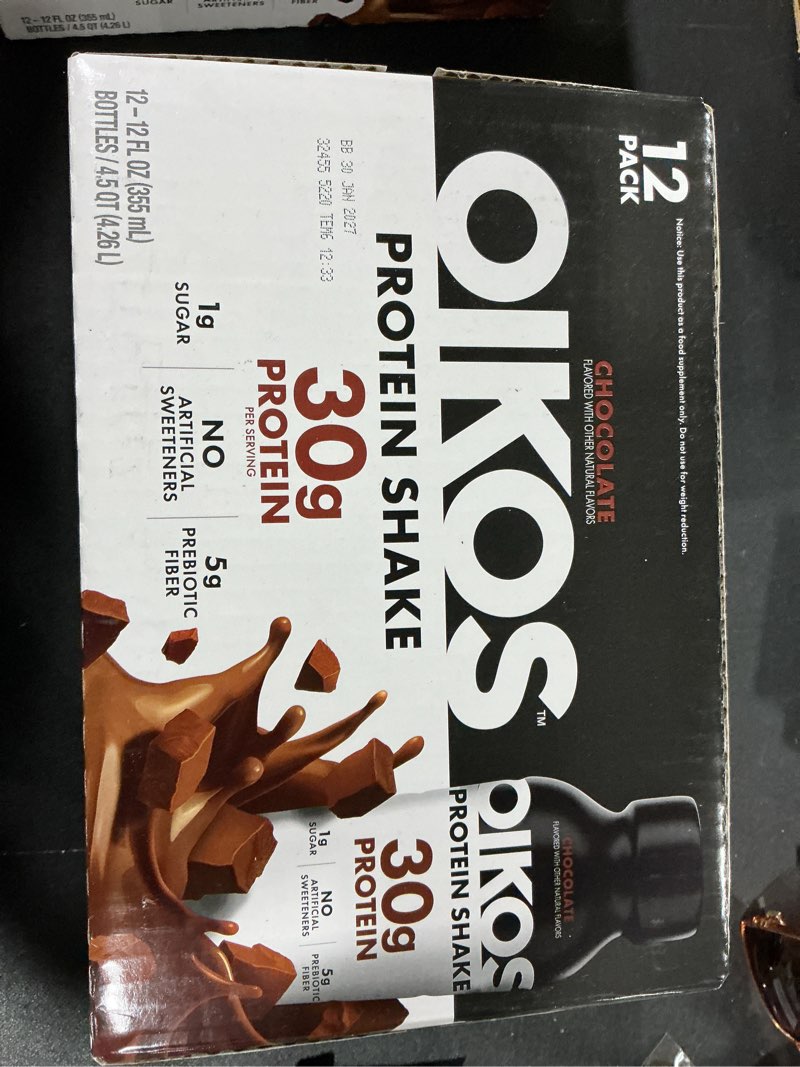 Condition photo showing New/Like New for Oikos Protein Shake, Chocolate, 30g High Protein Drinks, Shelf Stable, Ready to Drink, 5g Prebiotic Fiber, 12 fl oz Bottle, 12 Count?