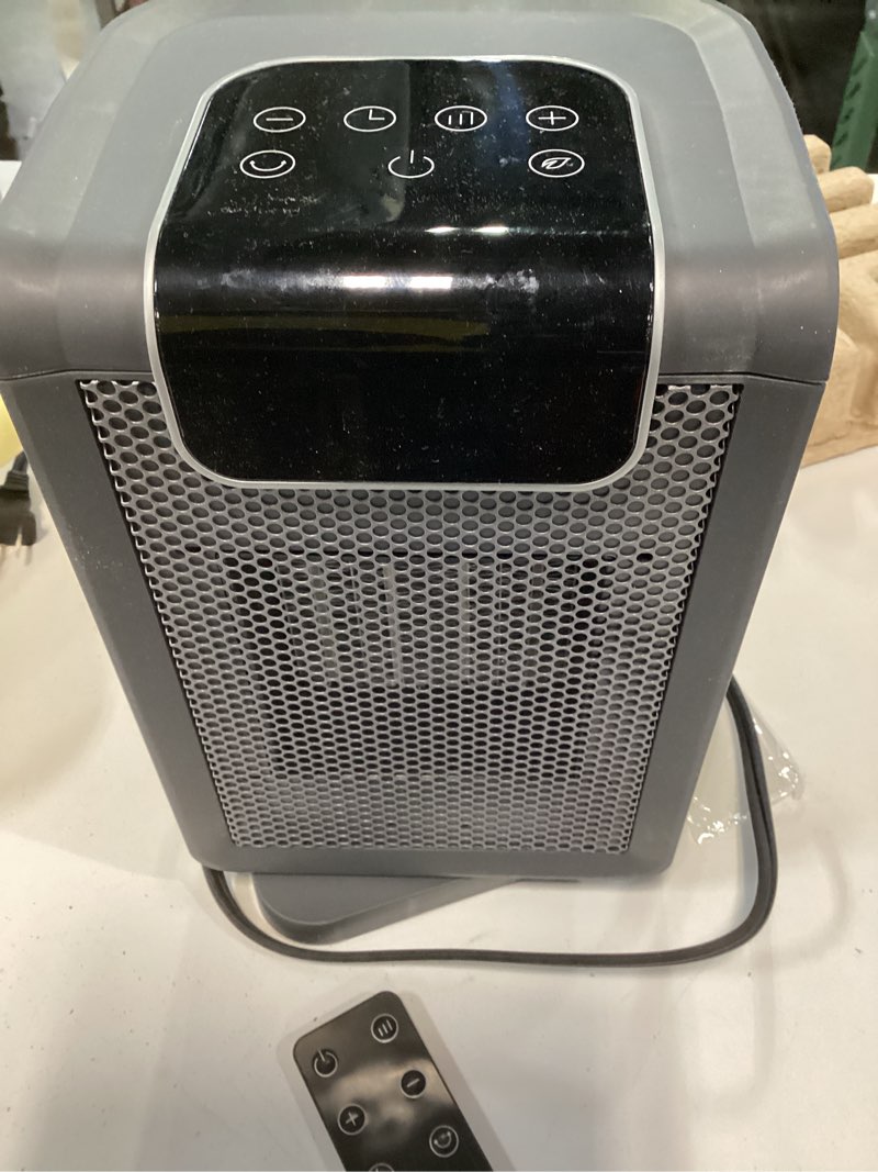 Condition photo showing As Is for Amazon Basics Ceramic electric heater with PTC technology, 1800W, oscillation 70°, 25 cm, Grey