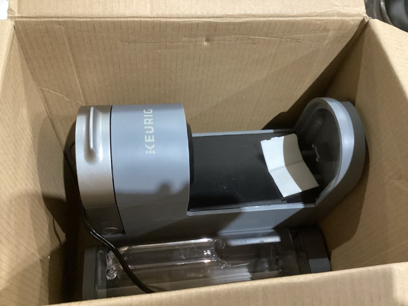 Condition photo showing As Is for keurig k-supreme single serve k-cup pod coffee maker, multistream technology, 4 brew sizes, 66oz dual-position removable reservoir, gray gray coffee maker