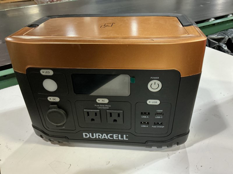 Condition photo showing As Is for duracell portable power station 500w (515 wh/120v) lithium battery backup portable solar generator (solar panel sold separately) for power outages, home emergency kits, camping, backyard, and outdoor