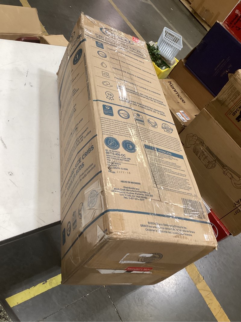 Condition photo showing As Is for graco crib & toddler mattress in box 