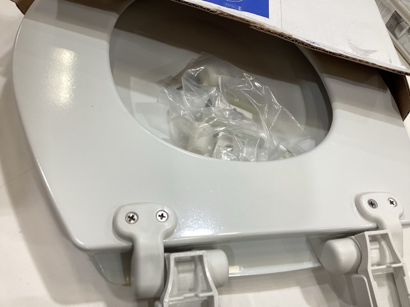 Condition photo showing As Is for mayfair by bemis kendall wood white round soft close toilet seat