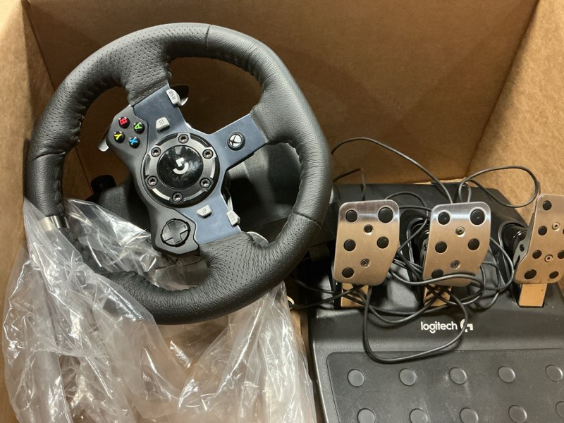 Condition photo showing As Is for Logitech G920 Driving Force Racing Wheel and Floor Pedals, Real Force Feedback, Stainless Steel Paddle Shifters, Leather Steering Wheel Cover for Xbox Series X|S, Xbox One, PC, Mac - Black Wheel Kit