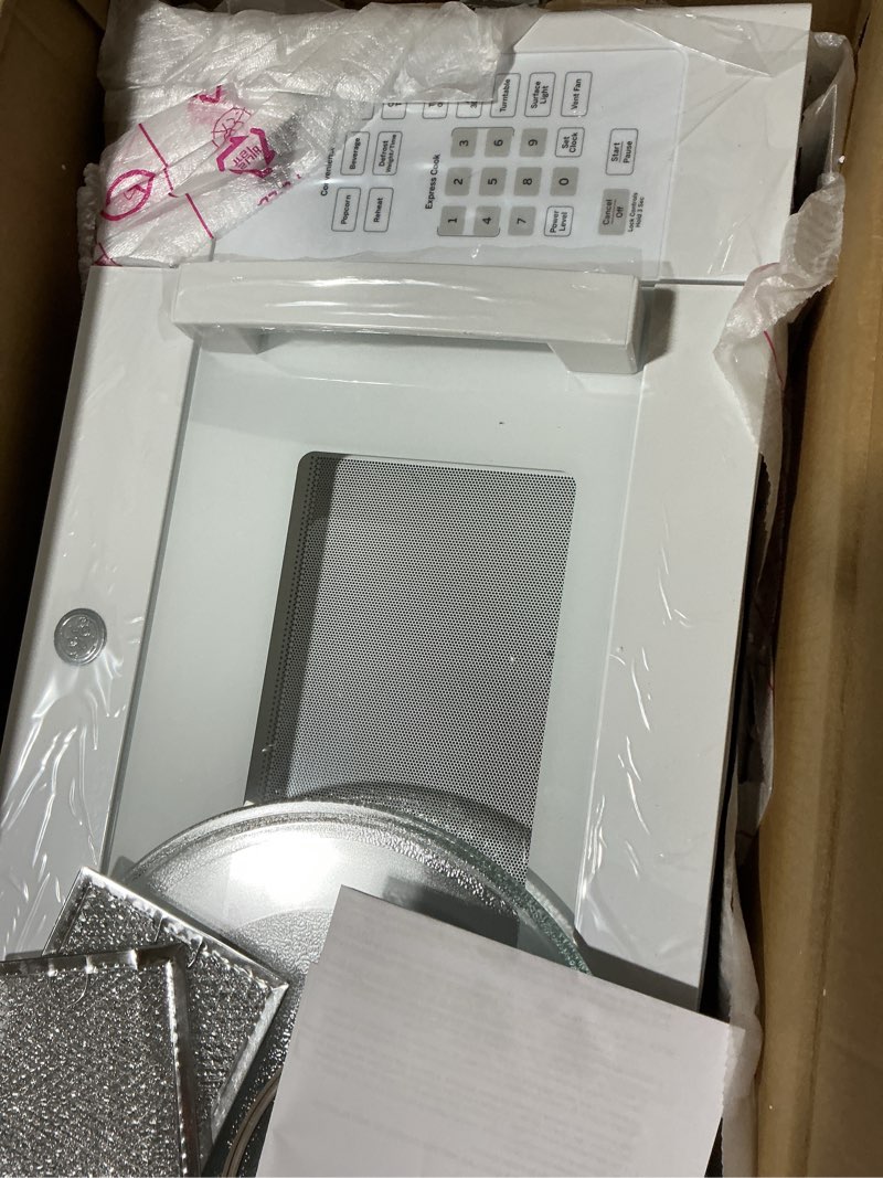 Condition photo showing Good Condition for possibly used ge 1.6 cu. ft. over-the-range microwave in white