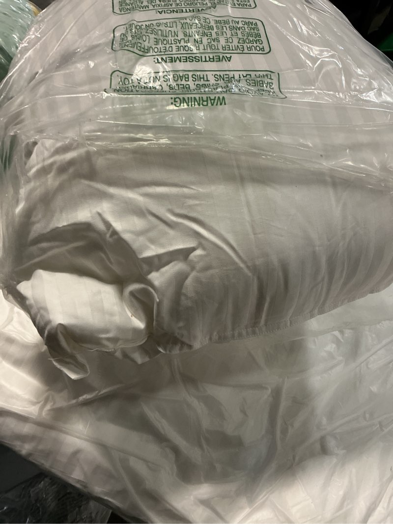 Condition photo showing Good Condition for oubonun queen size pillows set of 2 - fluffy & supportive down alternative pillows with zippered cotton cover - breathable and cool for all sleeping positions - machine washable - 20"x30" queen (pack of 2)