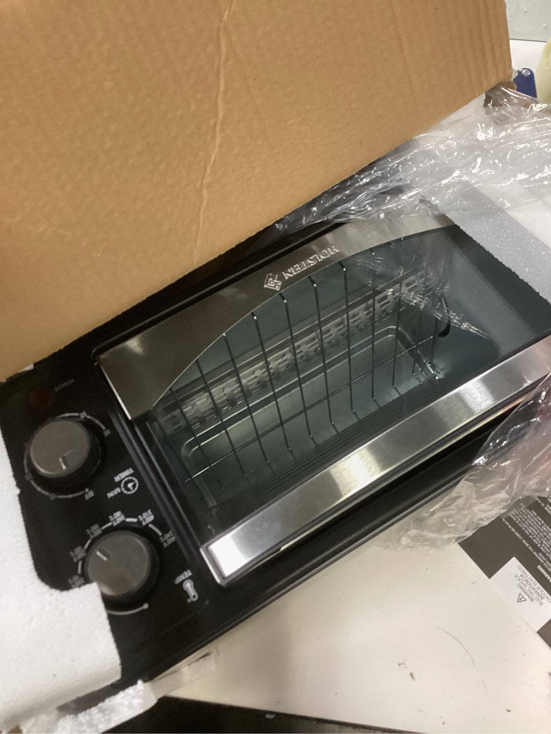 Condition photo showing Good Condition for Holstein Housewares 4 Slice Countertop Toaster Oven with 60 Minute Timer Includes Pan and Wire Rack, Perfect for Baking, Broiling, and Toasting Compact Design in Sleek Black for Convenient Kitchen Use Black / Stainless Steel 11.52"D x 7.9"W x 11.48"H