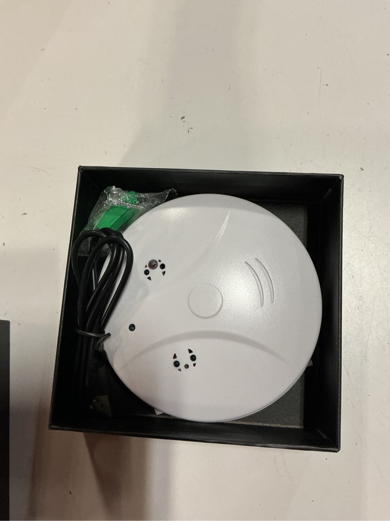 Condition photo showing As Is for 1080p hd wireless wifi camera smoke detector for home security with app control, motion detection, 150° indoor camera with night vision & loop recording for office/garage/shop/pet,user-friendly white