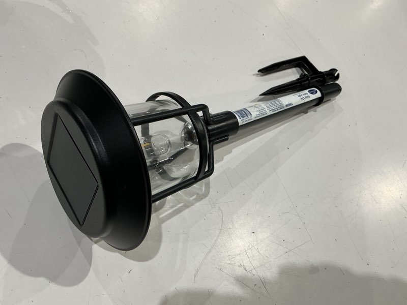 Condition photo showing As Is for harbor breeze 15 -lumens black solar led outdoor path light with dusk-to-dawn sensor