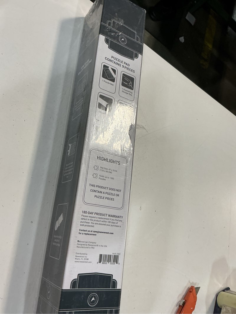 Condition photo showing New/Like New for The Original Newverest Jigsaw Puzzle Mat Roll Up, Silver, 46” x 26” Portable Keeper Up to 1500 Pieces with Non-Slip Rubber Bottom & Smooth Top + 3 Puzzle Sorting Trays & Travel-Friendly Storage Bag 1500pcs Silver
