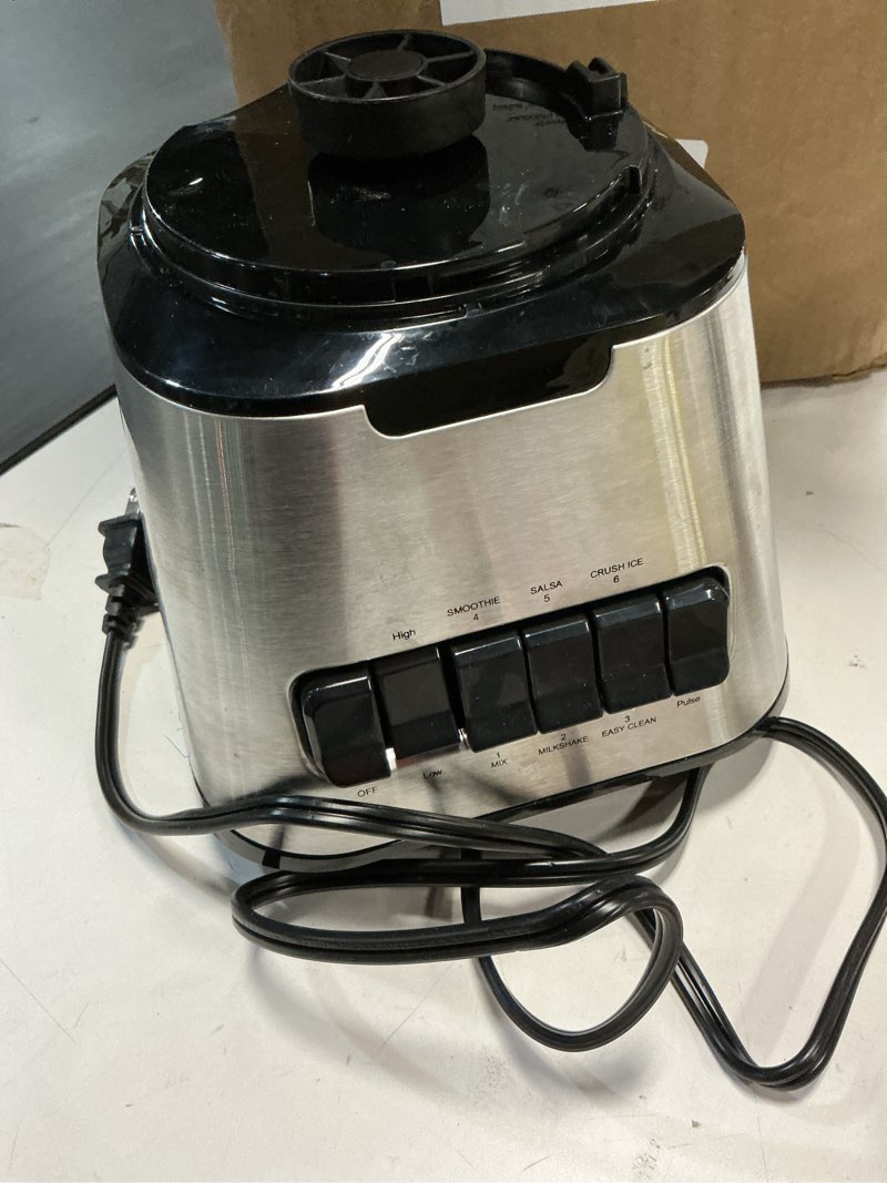 Condition photo showing As Is for Amazon Basics 6-Cup (50 Fl. Oz) Countertop Blender, with 6 Pre-Programmed Functions, Pulse, Ice Crush, Stainless Steel Blades, Glass Jar, Up to 700W, Black & Silver