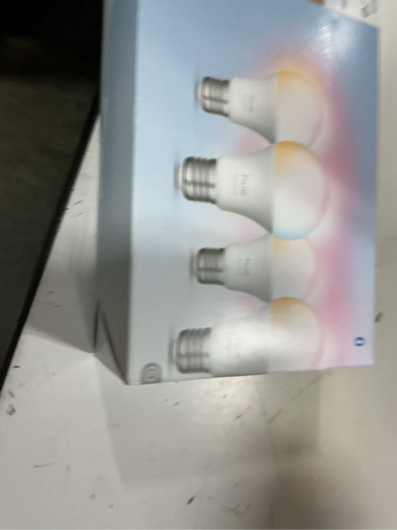 Condition photo showing New/Like New for philips hue essential smart led a19 bulb, white and color ambiance, e26 base, 8.8w, 2200k-6500k, 800 lumens, dimmable, works with alexa, google, and apple home, 4-pack 4 pack