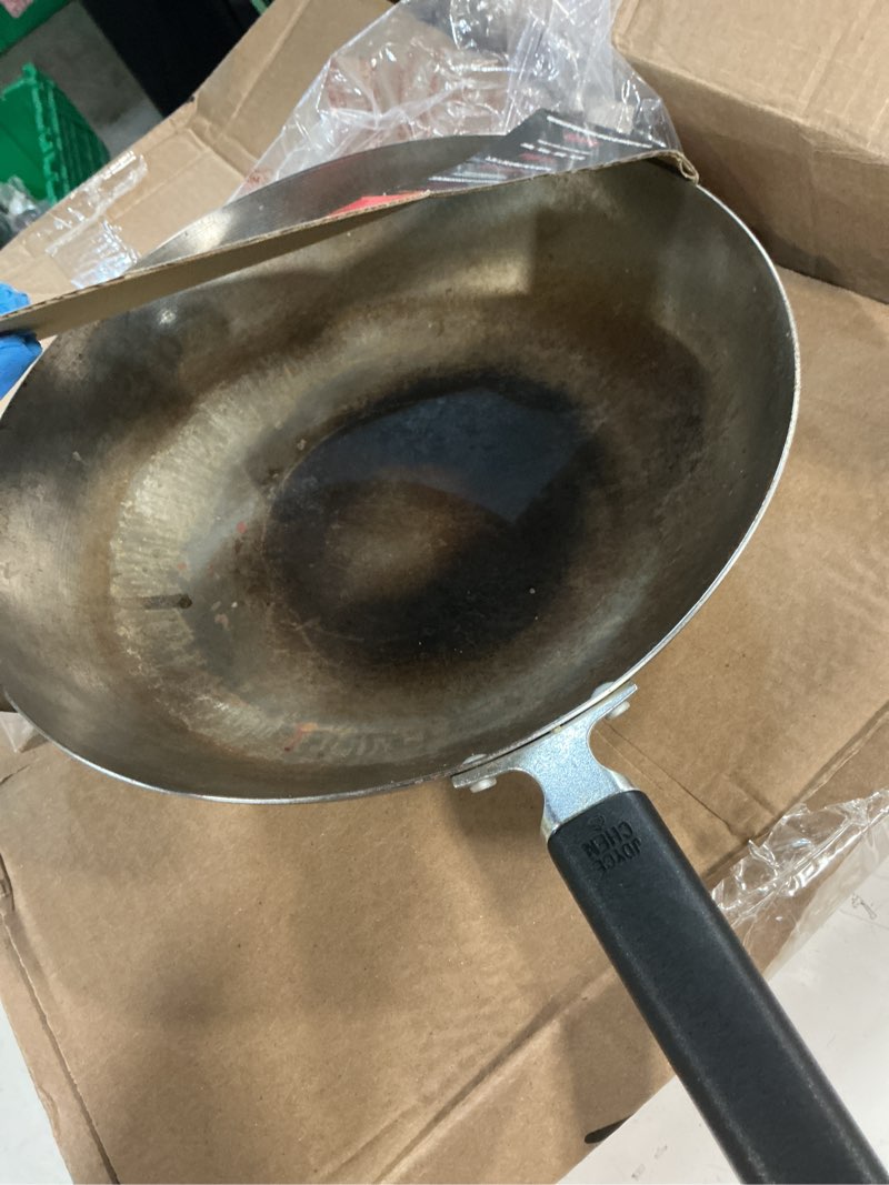 Condition photo showing As Is for joyce chen professional series 12-inch carbon steel stir fry pan with phenolic handle 12" stir fry pan