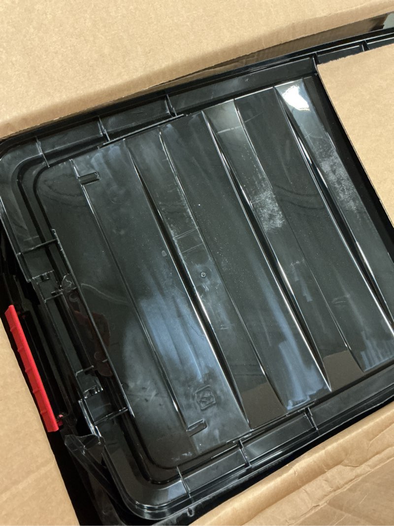 Condition photo showing As Is for IRIS USA 72 QT Plastic Storage Box with Lid and Latches - 4 Pack - BPA-Free, Garage Organizing Solution, Durable Nestable Stackable Containers, Secure Pull Handle - Black Black 72 Qt 4 Pack