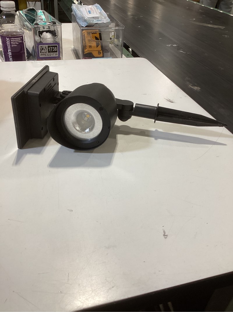 Condition photo showing As Is for portfolio 20 -lumens black solar led flood light