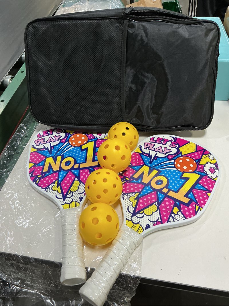 Condition photo showing New/Like New for pickleball paddle set - 2 paddles, 4 balls & bag bundle