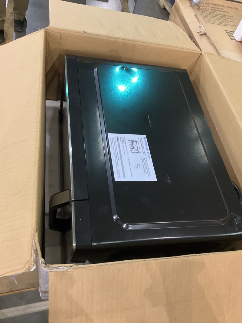 Condition photo showing New/Like New for Farberware 0.7 Cu. Ft. Countertop Microwave Oven – 700 Watts Power, Auto Cook Settings, Defrost, Easy Clean and Child Safety Lock - Stainless 0.7 Cu. Ft. Stainless Steel