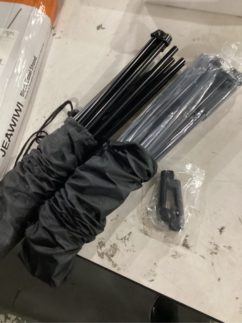 Condition photo showing As Is for jeawiwi 2pcs black easel stand for wedding sign stand, 66 inch portable adjustable poster stands for display, floor tripod collapsible display easel, balck metal easel stand with portable bags black 2 pcs