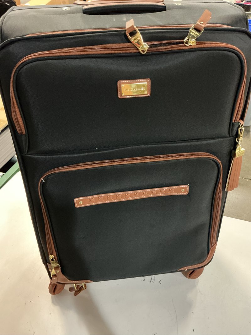 Condition photo showing As Is for steve madden designer luggage collection - expandable 28 inch softside bag for men & women - durable lightweight checked suitcase with 4-rolling spinner wheels (28in, global black) 28in global black