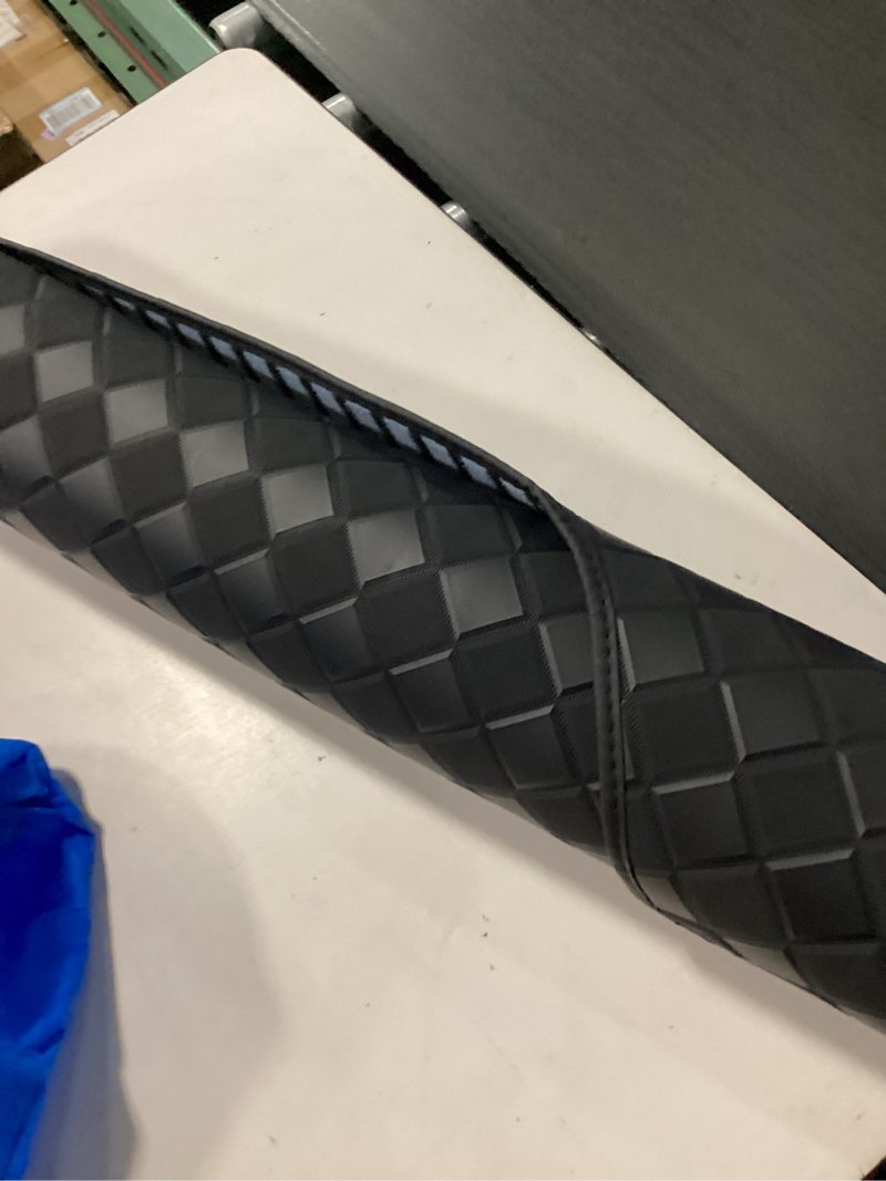 Condition photo showing As Is for black automotive mat features a distinct diamond-quilted pattern