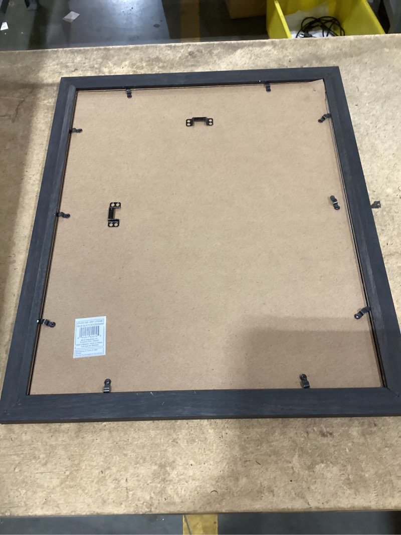 Condition photo showing As Is for mcs studio gallery classic 16x20 poster frame black woodgrain engineered wood, vertical & horizontal wall hanging large picture frame for photos, posters & art prints (1-pack) 16x20 black woodgrain