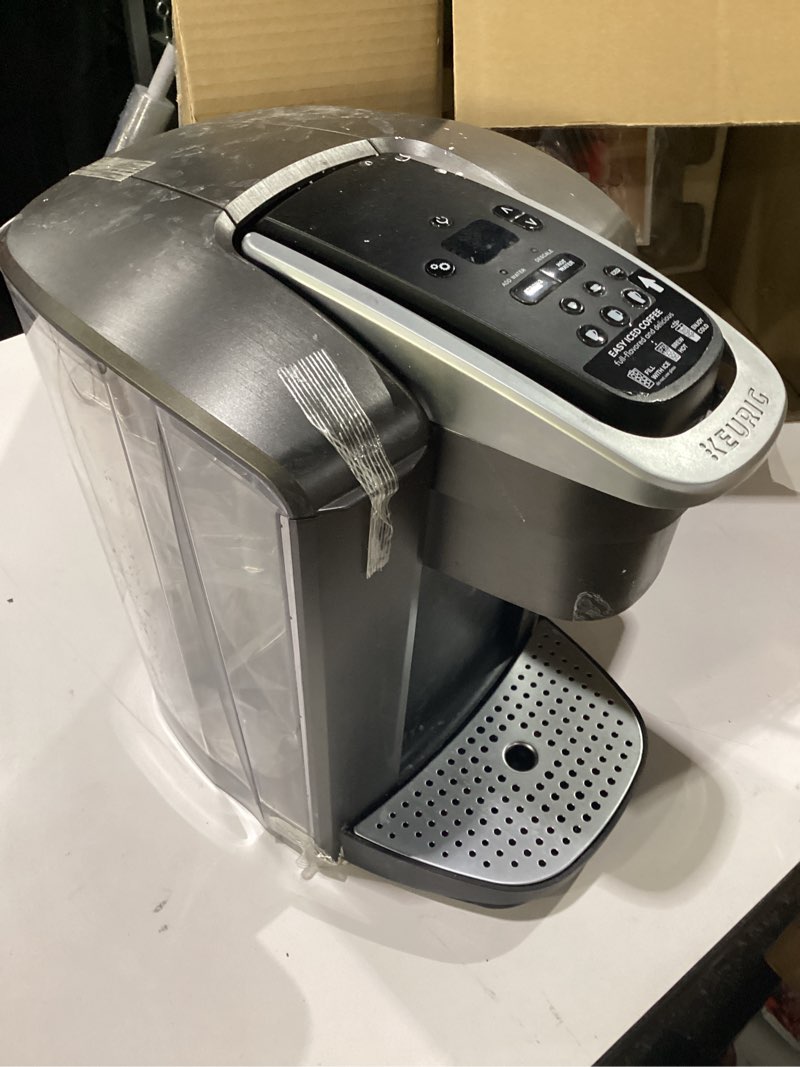Condition photo showing Good Condition for used keurig k-elite single serve k-cup pod coffee maker, with strength and temperature control, iced coffee capability, 8 to 12oz brew size, programmable, brushed slate