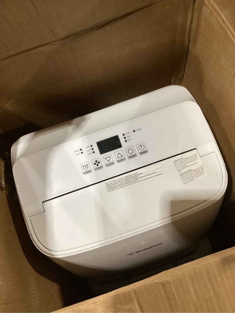 Condition photo showing As Is for westinghouse 14,000 btu air conditioner portable for rooms up to 700 square feet, portable ac with home dehumidifier, smart app, 3-speed fan, programmable timer, remote control, window kit, white 14,000 btu with smart app