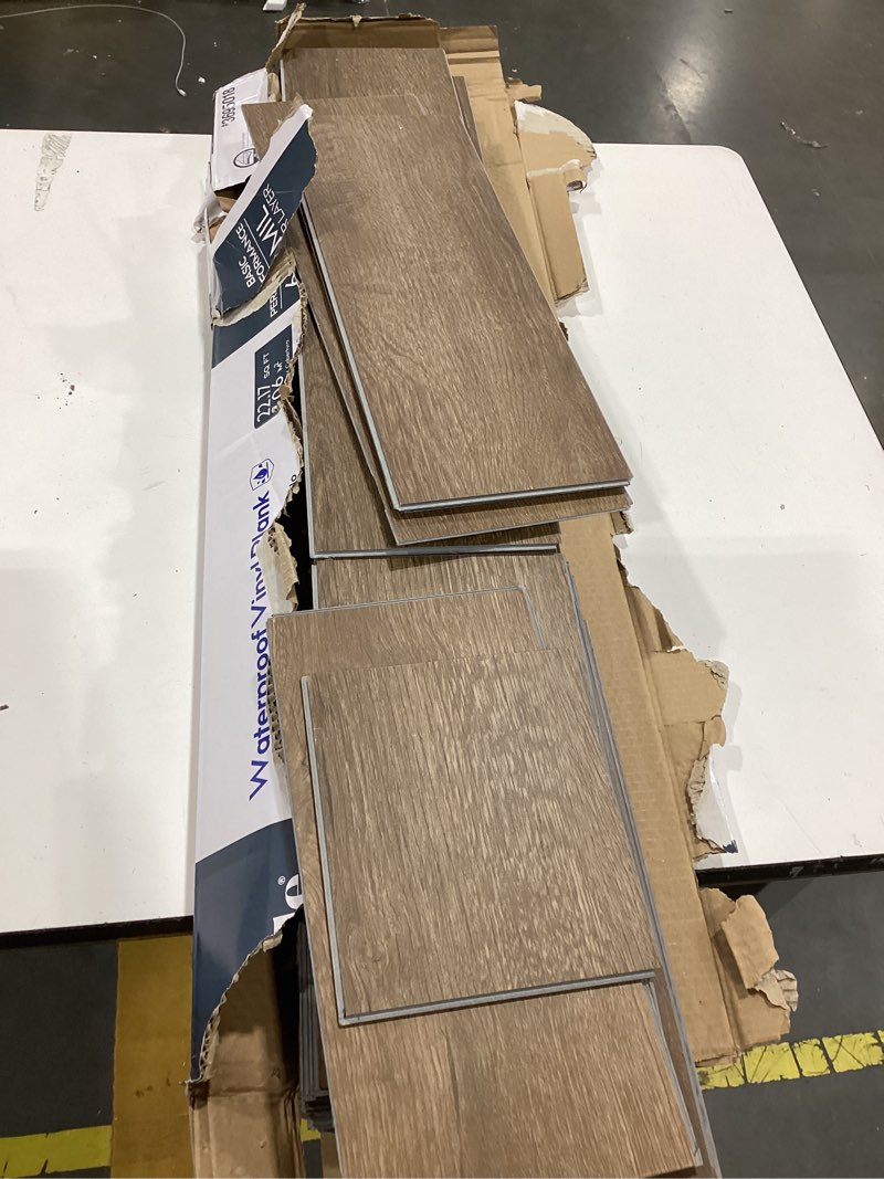 Condition photo showing As Is for  style selections tawny oak 6-mil x 6-in w x 36-in l waterproof click lock luxury vinyl plank flooring