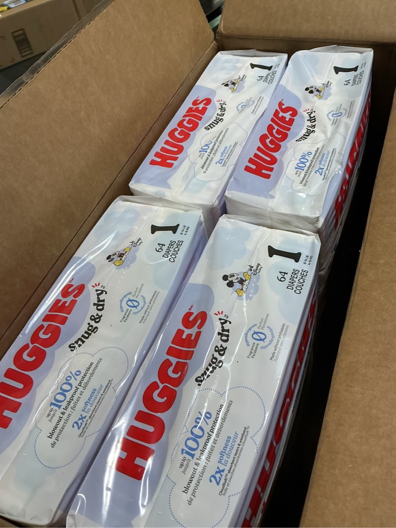 Condition photo showing New/Like New for Huggies Size 1 Diapers, Snug & Dry Newborn Diapers, Size 1 (8-14 lbs), 256 Count (4 Packs of 64), Packaging May Vary