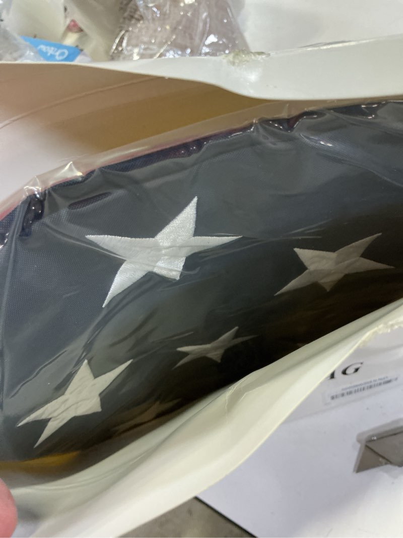 Condition photo showing New/Like New for american flag 4x6 ft: long lasting us flag, heavy duty nylon, embroidered stars, sewn stripes, brass grommets, uv protection perfect for outdoors! usa flag 4x6ft