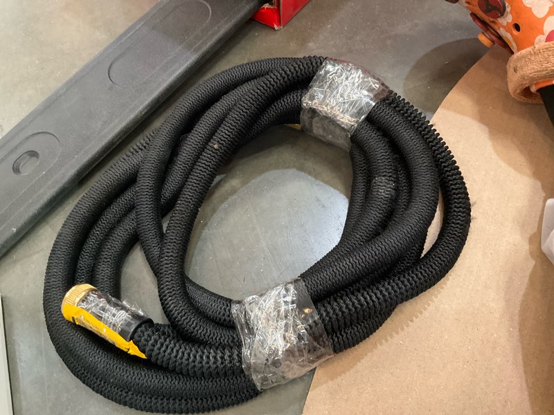Condition photo showing As Is for expandable hose